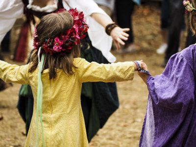 Girl Participating in Maypole Dance at Festival